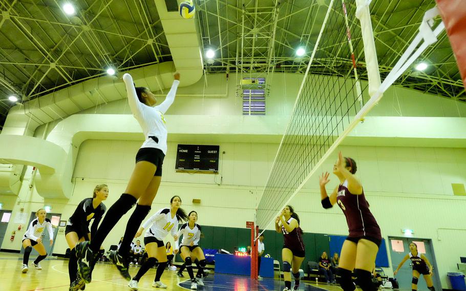 Kadena's Jaeda Flores goes for a spike kill during the Far East Tournament championship series at Yokota Air Base, Japan Nov. 5. Sixth-seeded Kadena lost its opening game match to Seisen International and fell to the consolation bracket.