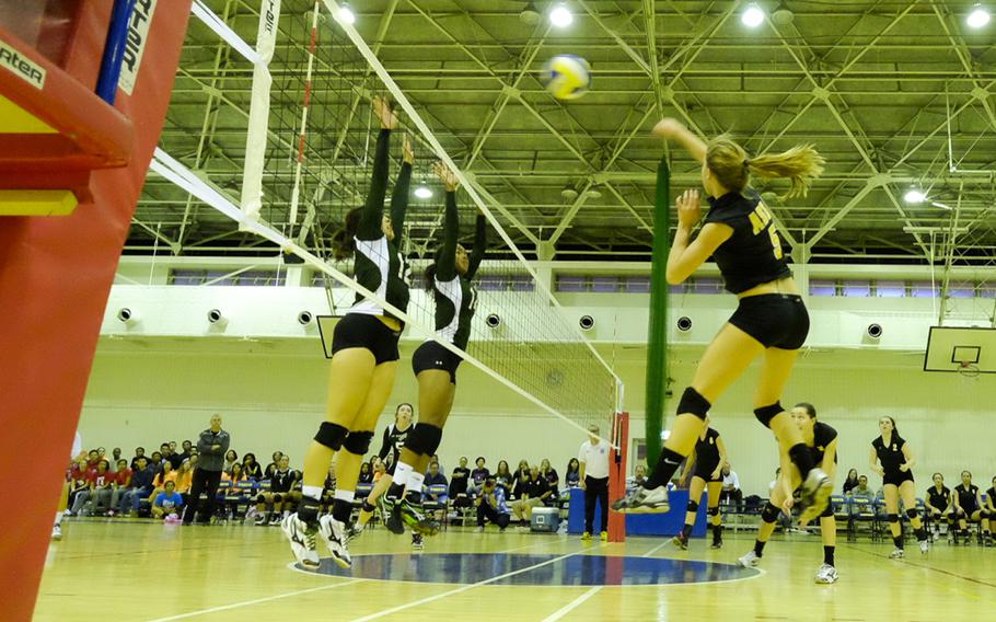 American School In Japan's Jenna Doyno hits over the Kubasaki defense during the Far East Tournament championship game Nov. 6, 2014 at Yokota Air Base, Japan. ASIJ lost the title game, their first loss of the season.