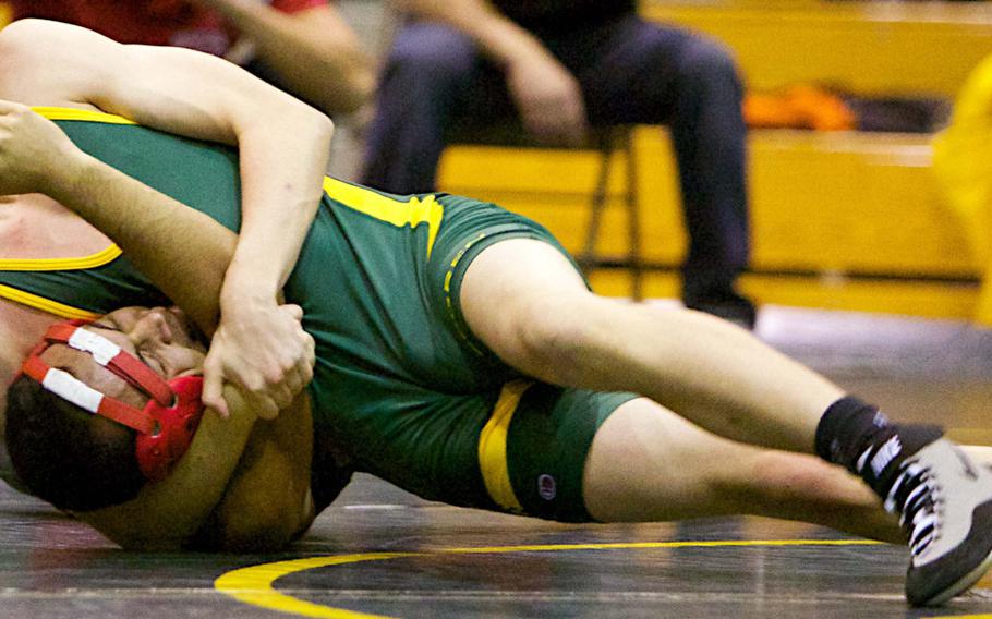 Kane Phillips of Robert D. Edgren locks in a head-and-arm hold on Jeremiah Ramos of Nile C. Kinnick during a warm-up dual meet Friday evening precursor to the Edgren Invitational Wrestling Tournament, the DODDS Japan traditional season-opening individual freestyle event that takes place on Saturday.