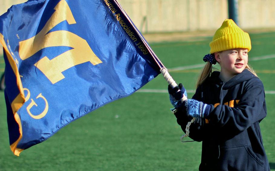 A young fan brandishes a Navy team flag during Saturday's Korea Army-Navy game.