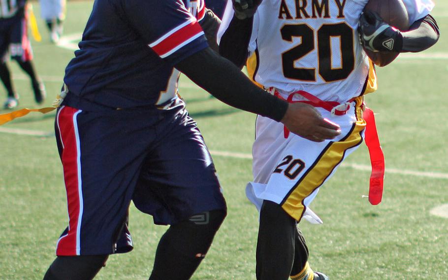 Army's Donald Lowrey tries to avoid Navy's Will Finley during Saturday's Korea Army-Navy game.