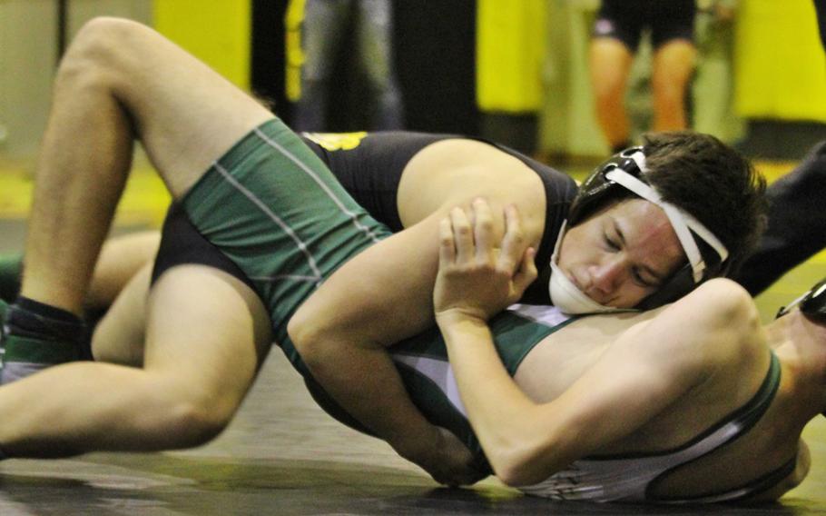 Kadena's Gabe Duplon gets the edge on Kubasaki's Richard Erland in the 122-pound bout of Wednesday's season-opening Okinawa wrestling dual meet. Duplon pinned Erland in 1 minute, 15 seconds, and the Panthers won the dual meet 29-28.