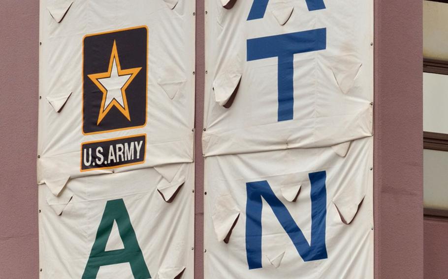 A banner on the side wall of Torii Station's fitness center takes definite sides with the soldiers on Friday during a Army and Navy flag football game.