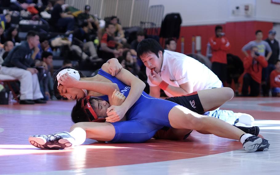 St. Mary's Chang Young Lee pins Nile C. Kinnick's Matthew Abrenilla in the 108-pound Beast of the East semifinal.
