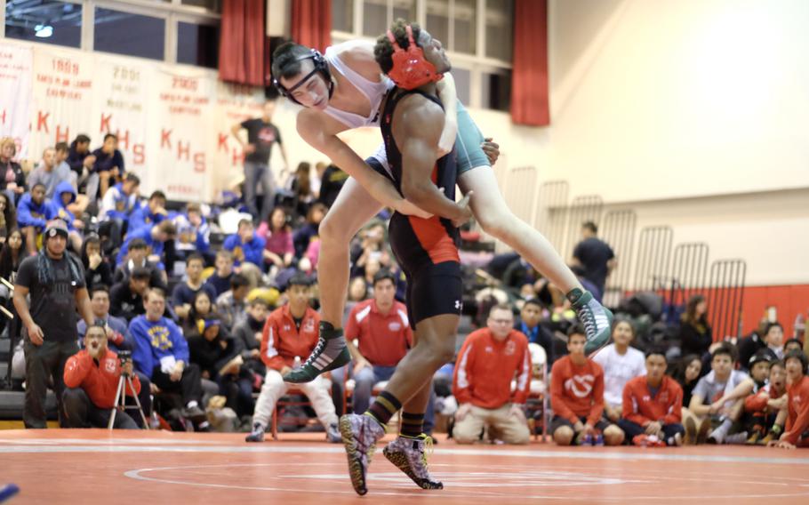 Nile C. Kinnick's Dre Paylor pinned Kubasaki's Brendan Miracle in the 168-pound championship of the Beast of the East wrestling tournament.