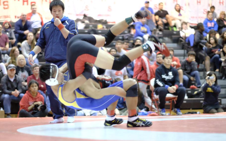 St.Mary's Ryo Osawa throws Nile C. Kinnick's Jianni Labato to win the 122-pound championship of the Beast of the East wrestling tournament.