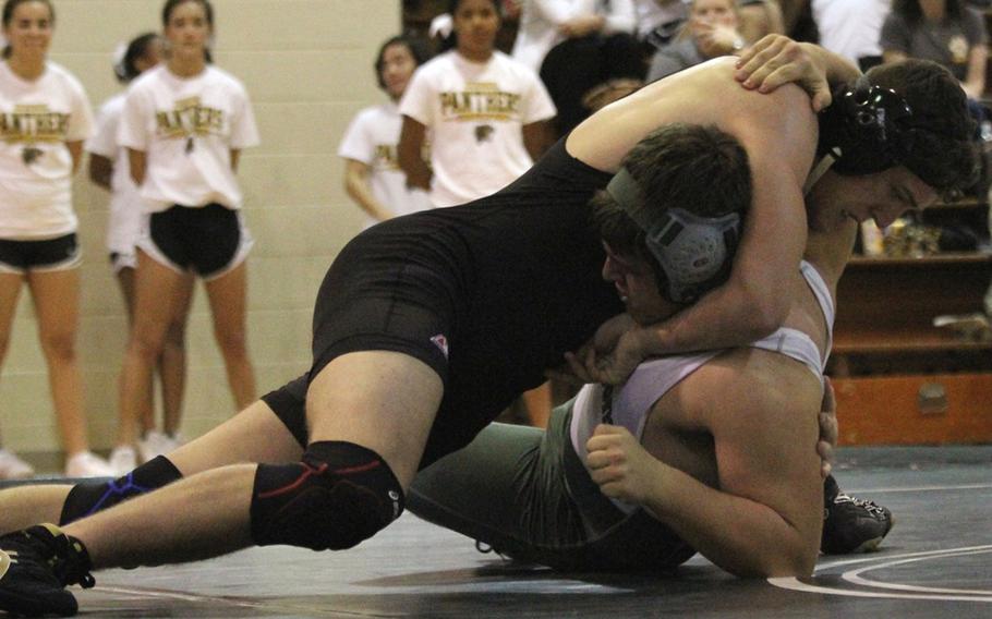 Dominic Santanelli of Kadena pins Kubasaki's Gary Turner at 180 pounds in 1 minute, 49 seconds, clinching the Panthers' third dual-meet win of the season over the Dragons.