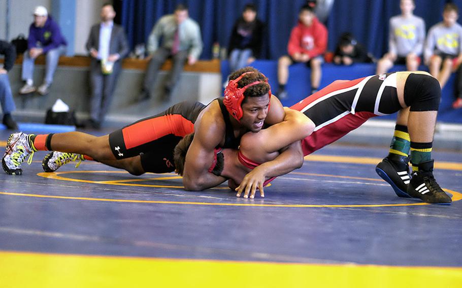 NIle C. Kinnick Dre Paylor pins E.J. King Keagan Longton in the 168 -pound championship match at the DODDS Japan Wrestling Tournament Jan. 24 at Yokota High School in Fussa, Japan.