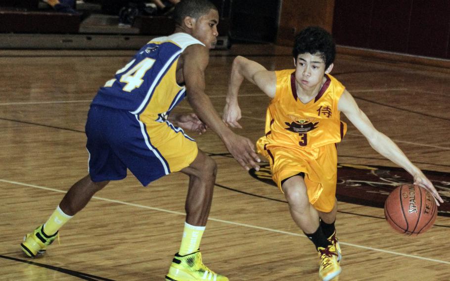Jadan Anderson of Yokota and Vincent Ermitano of Matthew C. Perry, shown playing in a Jan. 10, 2014 DODDS Japan regular-season game, will face off Friday at Yokota's Capps Gym for the first time as Division II opponents.