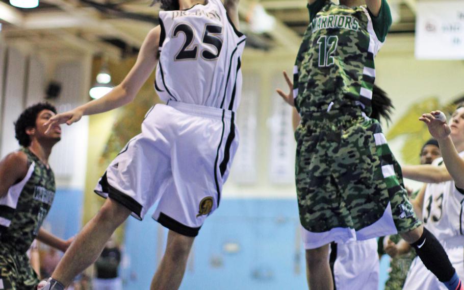 Daegu's Joone Abaya gains possession of the rebound against Taejon's Beomchul Choi in Saturday's consolation match. The Dragons beat the Warriors 51-41 in the Korean American Interscholastic Activities Conference Blue Division tournament on Saturday, Feb. 7, 2015, at Yongsan Garrison.

