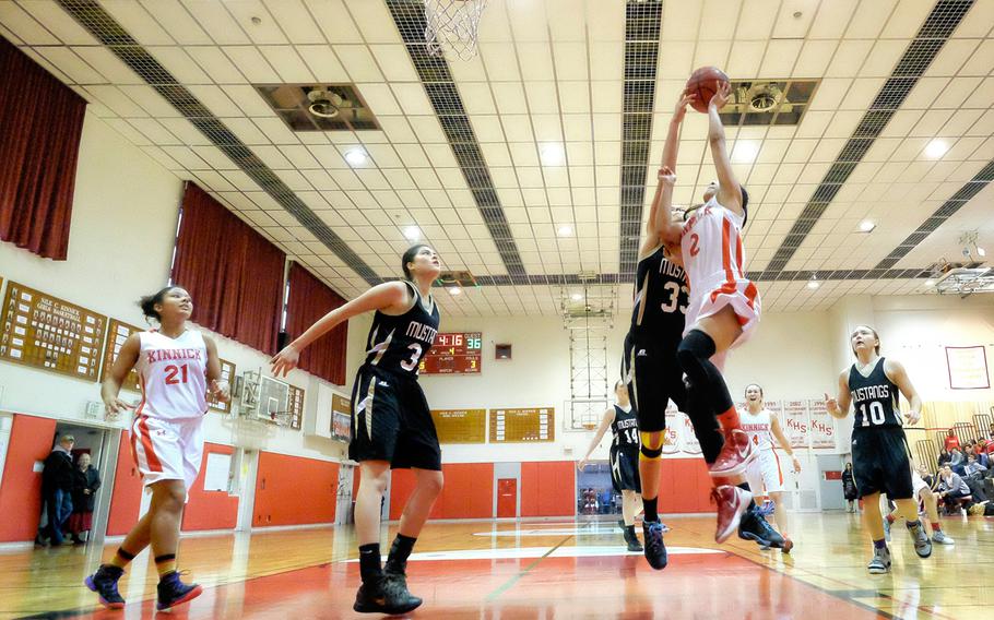 American School in Japan's Mia Weinland (33) blocks a shot by Nile C. Kinnick's Rhyssa Hizon (2) during the 1st semifinal game of the Division I girls Far East basketball tournament Wednesday, Feb. 18, 2015, at Yokosuka Naval Base, Japan. 