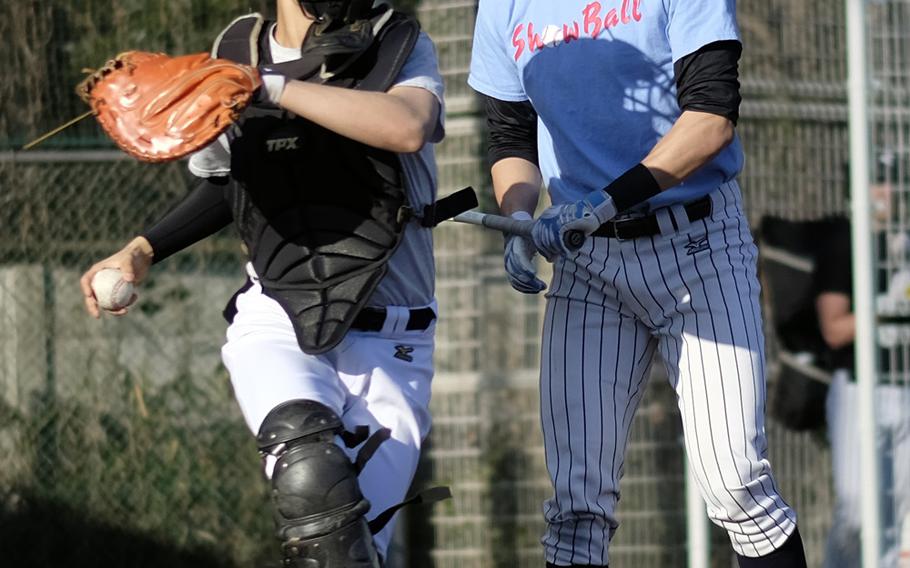 American School In Japan catcher Kenji Yoshi attempts to throw out a base stealer during a team scrimmage Wednesday in Chofu, Japan. ASIJ is the returning Far East Division I champion.