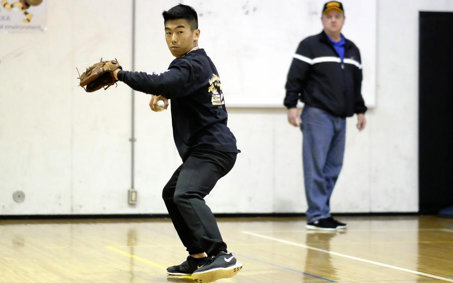 Zama pitcher Keiyl Sasano practices in the school's gymnasium during spring training at Camp Zama, Japan on Tuesday, March 11, 2015. Zama is the returning Far East Division II champion.
