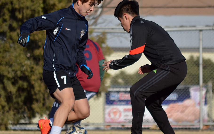 Seoul American sweeper HoKyong Adkins and defensive midfielder David Han go through their practice paces on Wednesday. The Falcons are in a rebuilding year after having lost seven starters from last year's team.