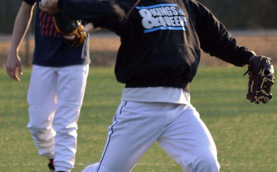 Seoul American pitcher/infielder/catcher Daniel Salazar with Falcons infielder/pitcher Andrew Kovsky in the background during Wednesday's practice.