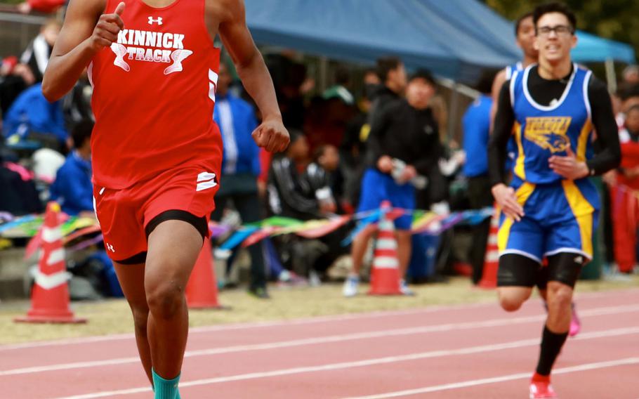 Nile C. Kinnick sprinter Jabari Johnson leads the pack to the finish line in the 400-meter run during Saturday's track meet at Yokota. Johnson, who a year ago became the first northwest Pacific runner to record a sub-50-second 400 under fully automated timing, won the event in 51 seconds.