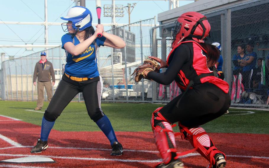 Yokota's Anysia Torres stands in at the plate in front of Nile C. Kinnick catcher DeShauna Carter during Tuesday's DODDS Japan-Kanto Plain girls softball game. Torres allowed three hits, walked none and struck out two as the Panthers routed the Red Devils 30-2 in three innings, Yokota's first win at Kinnick in the Far East Tournament era.