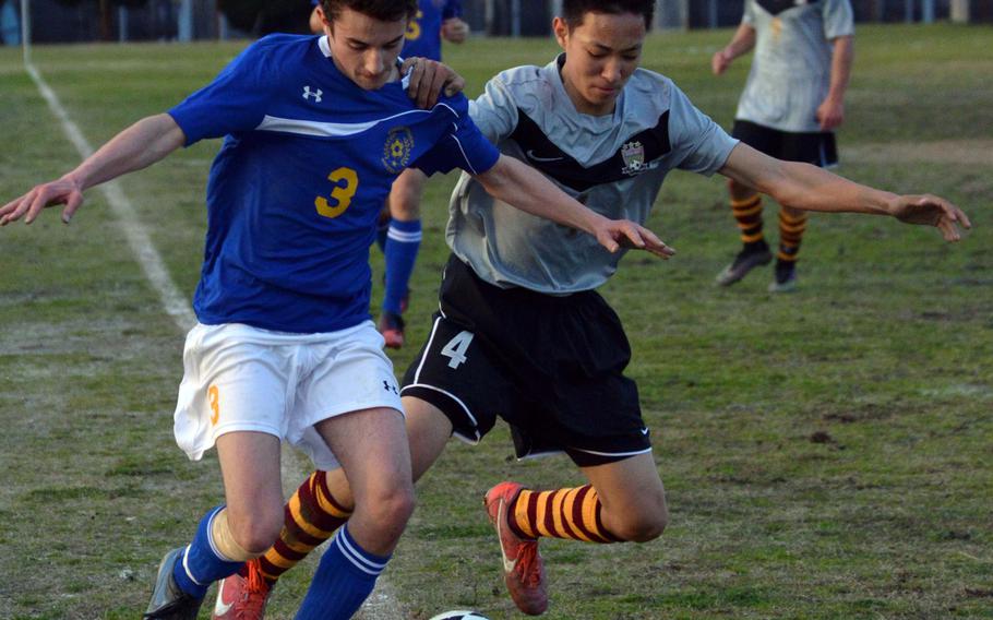 Matthew C. Perry's Justin Hill and Yokota's Ray Hernandez battle for the ball along the sideline during Friday's DODDS Japan boys soccer match. The teams played to a 3-3 draw.