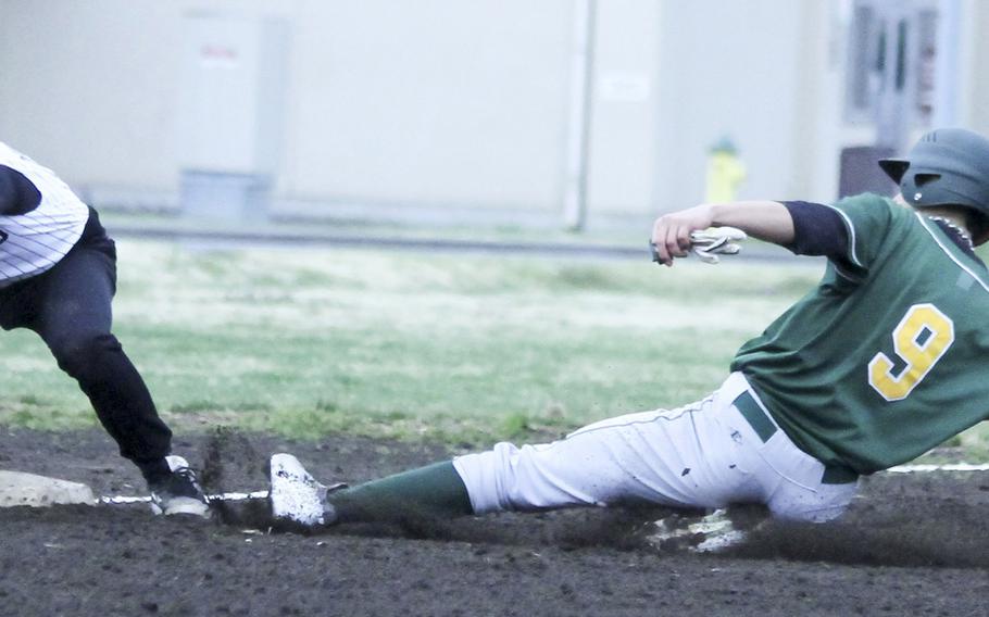Robert D. Edgren's Isaac Victorino slides in safely at third base ahead of the tag of Zama's Dakota Lyles during Saturday's DODDS Japan baseball game. The Eagles won 7-0 to avert a three-game sweep.