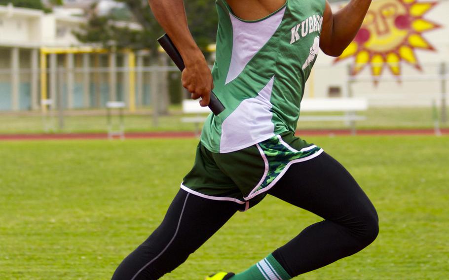 Kubasaki's Johann Wright runs the anchor leg of the 400-meter relay during Okinawa's season-opening track and field meet. Kubasaki won in 45.48 seconds.
