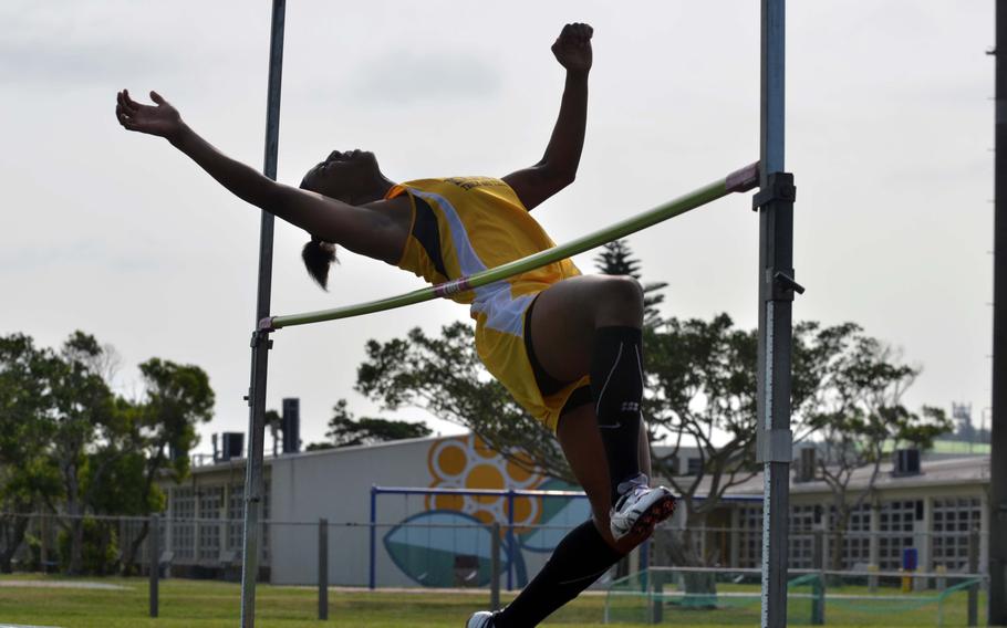 Kadena's Jasmine Rhodes clears 5 feet to win the girls high jump in Saturday's Okinawa season-opening track and field meet.