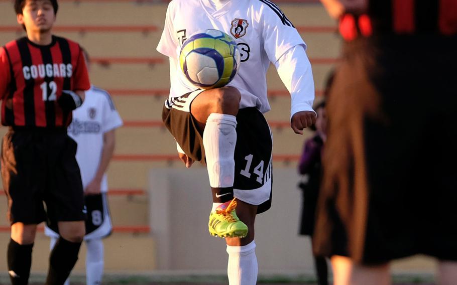 Zama's Malik Wilkes juggles the ball before hosting St. Maur on March 24, 2015 at Camp Zama, Japan. Wilkes scored the final goal beating St. Maur 2-0, extending the Trojans' record to 5-0.