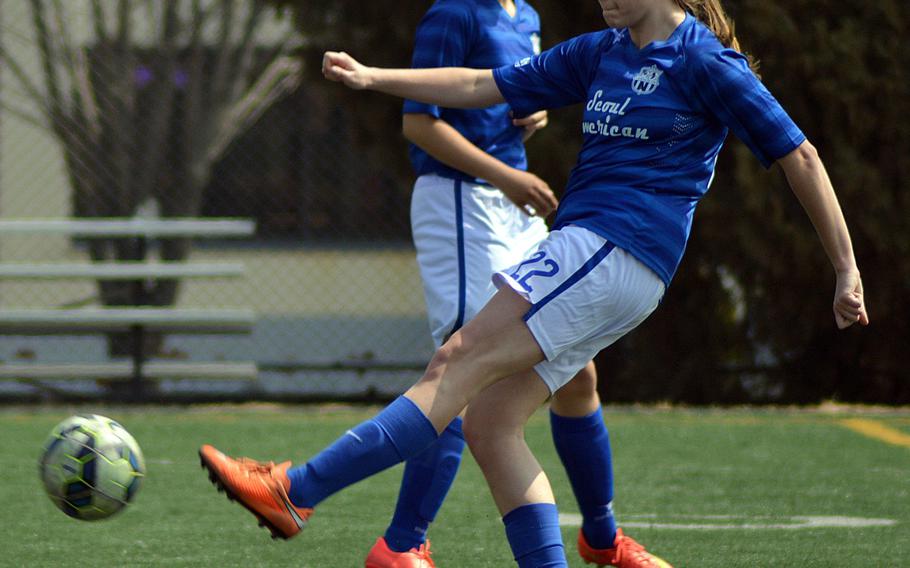 Seoul American's Charley Smith boots the ball against Daegu during Saturday's Korea girls soccer match. The Falcons won 6-1.