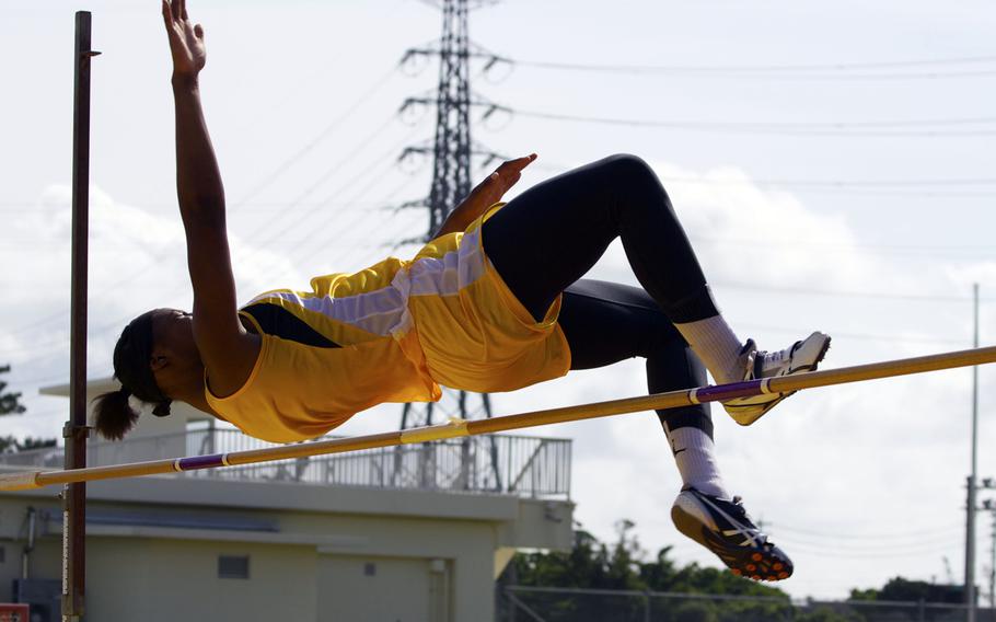 Kadena's Jasmine Rhodes clears the bar during the girls high jump in Saturday's Okinawa track and field meet. Rhodes won with a jump of 4 feet, 10 inches.