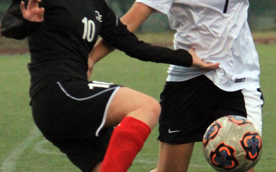 Seoul Foreign's Sofia Migues and Daegu's Yenah Joe battle for the ball during Thursday's Korea girls soccer match. The visiting Crusaders routed the Warriors 9-0.
