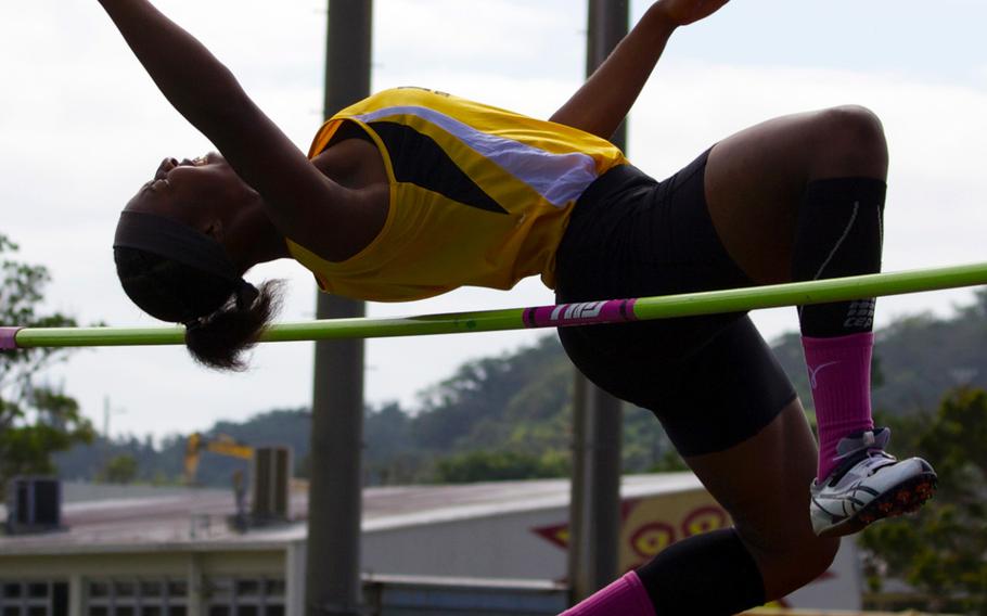 Jasmine Rhodes clears the high-jump bar en route to winning first during the Mike Petty meet with a jump of 5 feet, 1 inch.