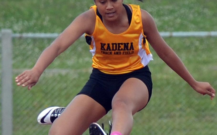 Kadena's Apryl-len Cabase leaps her way to first place in the 300 hurdles during the Mike Petty meet April 03, 2015.