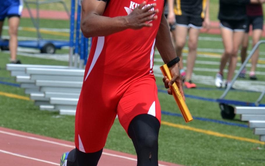Nile C. Kinnick junior Dre Paylor runs the anchor leg and brings home the baton in the 400 relay, which the Red Devils won in 45.71 seconds.