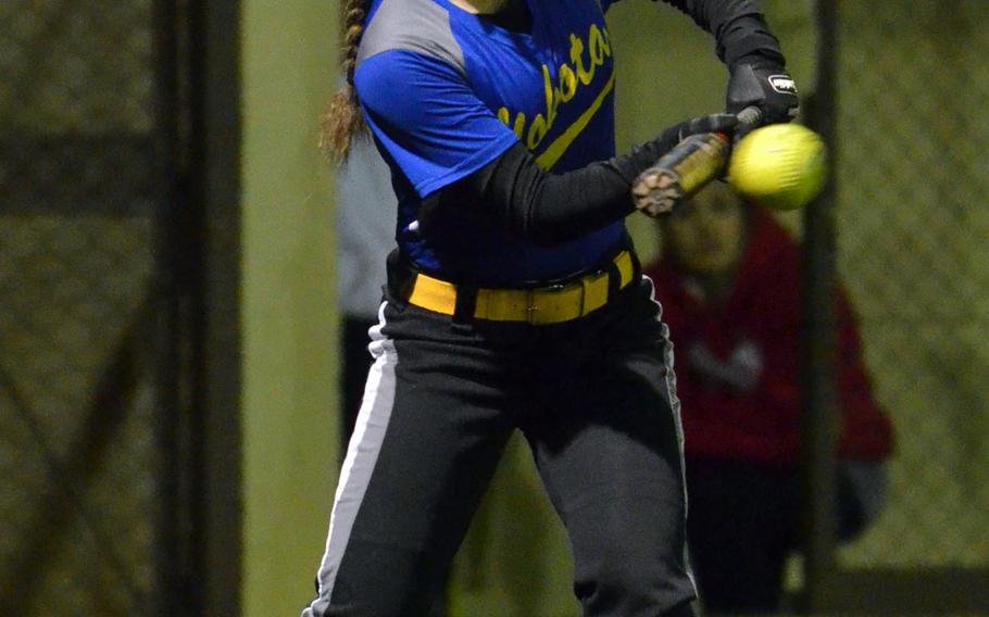 Yokota's Taylor Peche' drops a bunt against Nile C. Kinnick during Saturday's DODDS Japan softball tournament game, which the Panthers won 13-5.
