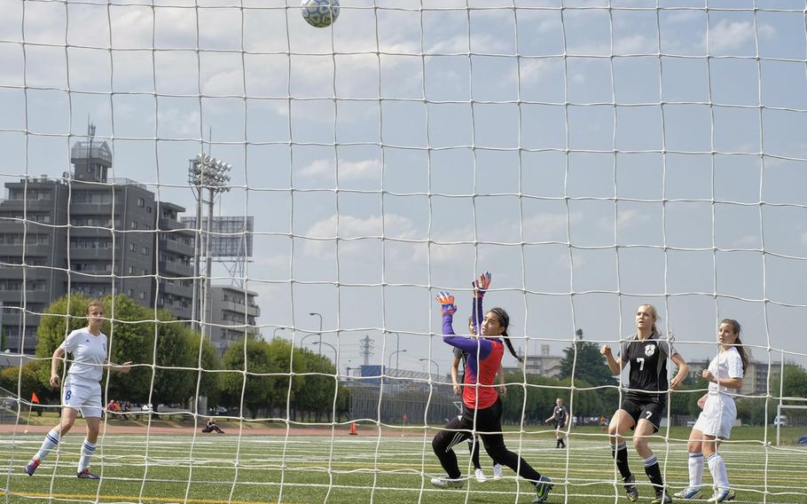 Yokota goalkeeper Sarah Cronin watches the ball soar over the net April 23, 2015 during the opening match of the DODDS Japan District girls soccer tournament at Yokota Air Base, Japan. The game ended in a scoreless draw.