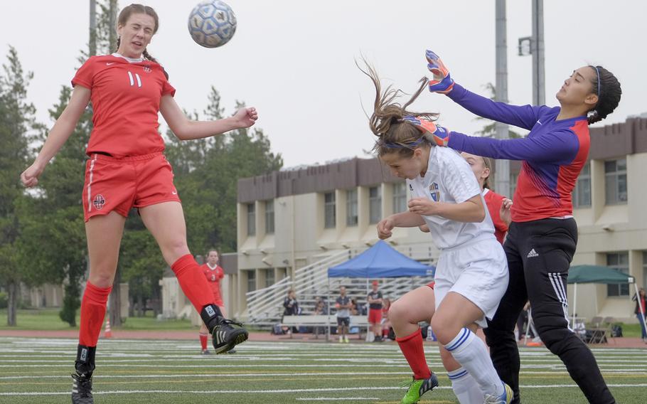 Nile C. Kinnick's Katrina Reid attempts to head in a corner kick during the championship match of the DODDS Japan Girls Soccer Tournament at Yokota Air Base, Japan on Saturday, April 25, 2015. Kinnick went on to win the title 3-1.