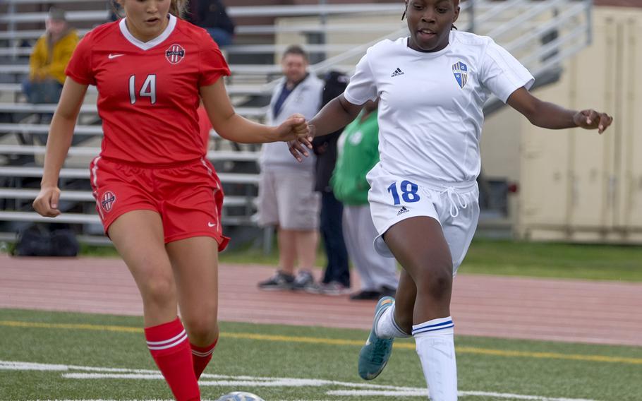 Nile C. Kinnick defender Charla Johnson takes the ball from Yokota striker Jamia Bailey during the championship match of the DODDS Japan Girls Soccer Tournament at Yokota Air Base, Japan on Saturday, April 25, 2015. Kinnick went on to win 3-1.