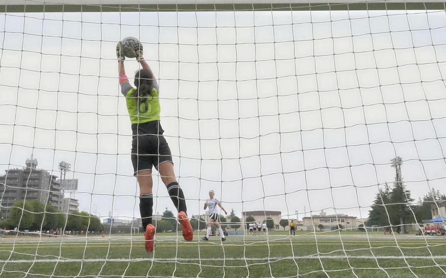 Zama's Lisa Steiner saves a penalty kick attempt during the third-place match of the DODDS Japan Girls Soccer Tournament at Yokota Air Base, Japan on Saturday, April 25, 2015. This save was the only play separating the winner from the loser.