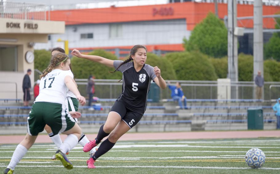 Zama's Sabrina Hunter shakes past the Robert D. Edgren defense in the Trojans' win during the third-place match of the DODDS Japan Girls Soccer Tournament at Yokota Air Base, Japan on Saturday, April 25, 2015. After drawing through regulation and overtime, it took six sets of penalty kicks to finally make Zama victorious.