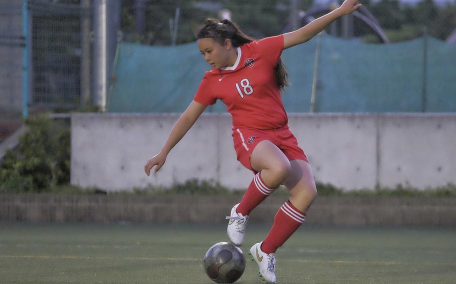 Nile C. Kinnick's Kiralyn Kawachi attempts to regain her balance during a game against the American School in Japan  April 27, 2015, at ASIJ in Chofu, Japan. The match ended in a 1-1 draw.