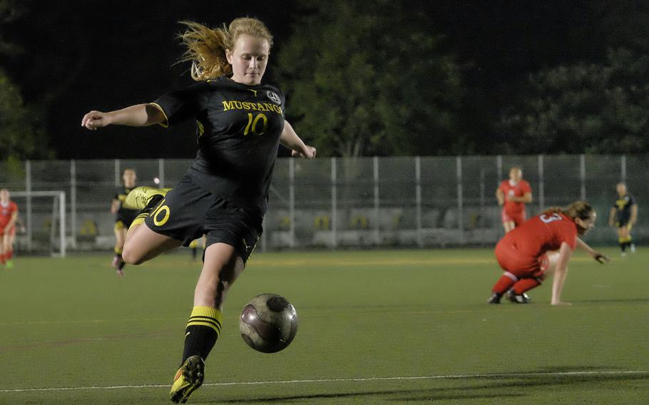 American School in Japan's Kat Johnsonn takes a shot on goal against Nile C. Kinnick April 27, 2015 at ASIJ in Chofu, Japan. The match ended in a 1-1 draw.