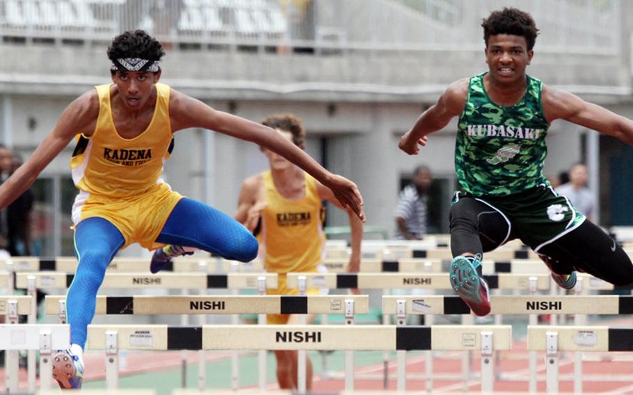 Devin Ross of Kadena and Jacob Green of Kubasaki head to the finish in the 110 hurdles; Ross edged Green 16.64 seconds to 16.88 for the win.