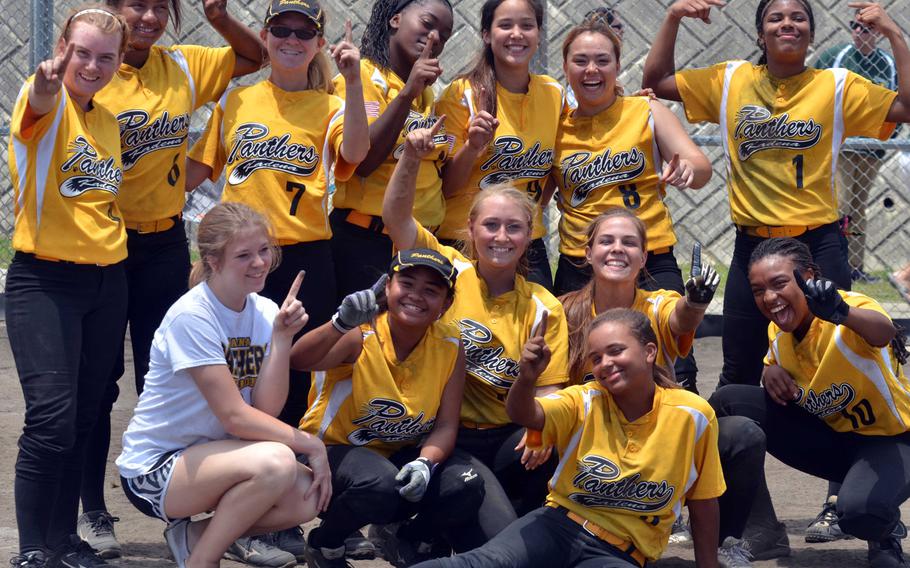 Kadena players strike victory poses following Saturday's Game 2 of the best-of-three Okinawa district softball finals. The Panthers beat Kubasaki 16-6 in five innings to sweep the series 2-0.