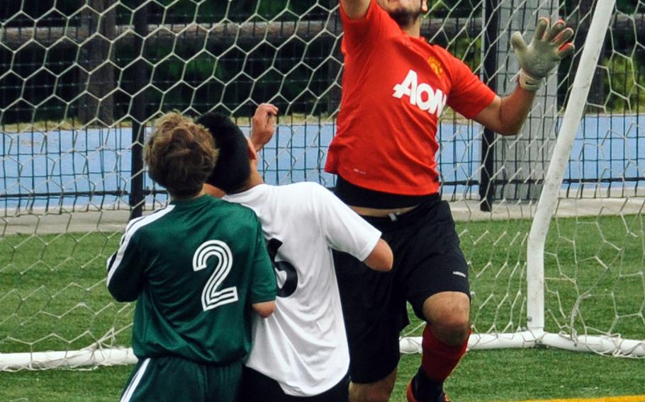 Zama goalkeeper Ryuji Vandeusen helps preserve a 0-0 tie with Edgren in front of teammate Yudai Harashima and Edgren's Corey Mathews in boys D-II soccer action.