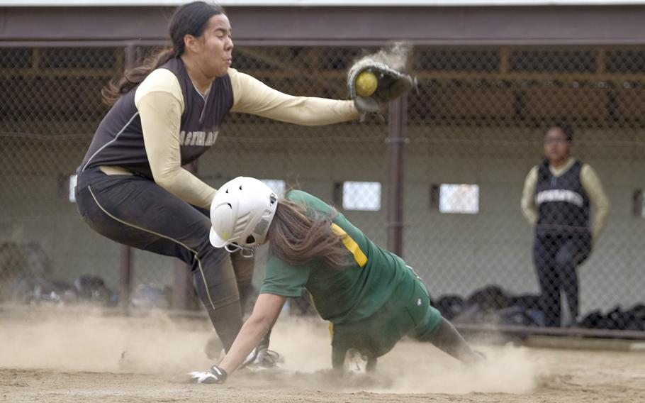 Robert D. Edgren's Raeven Moore gets under the tag by Humphreys' Vanessa Engram after a passed ball during Edgren's 18-3 win in Pool B play of the Far East Division II Softball Tournament on Monday, May 18, 2015 at Yokota Air Base, Japan's Friendship Field.