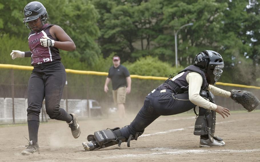 Zama's Kimani Ferguson beats a throw to Humphreys' Tatyanna Hyman during Zama's 36-1 rout in Pool B play of the Far East Division II Softball Tournament on Monday, May 18, 2015 at Yokota Air Base, Japan's Friendship Field. Zama is 2-0 with after outscoring its opponents by 50 runs.