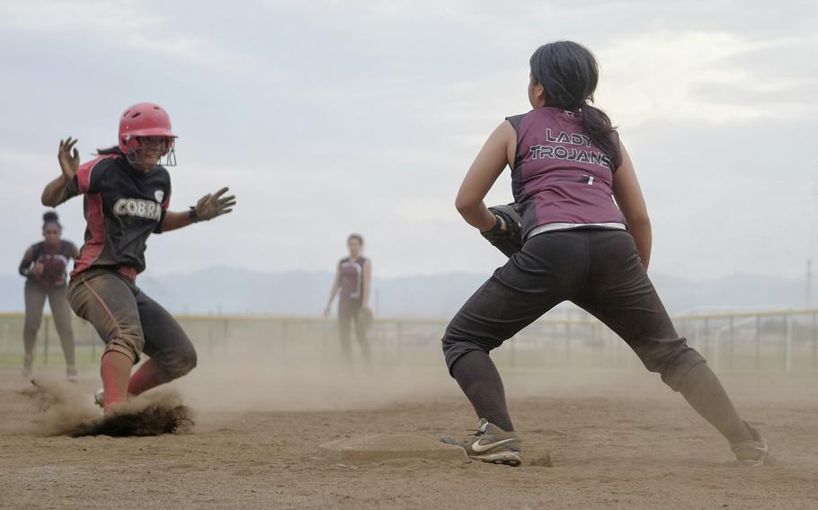 Zama's Nova Rivera catches E.J. King's Sakura Boyd in a pickle after a failed stolen base attempt in Pool B play of the Far East Division II Softball Tournament on Monday, May 18, 2015 at Yokota Air Base, Japan's Friendship Field. Zama went on to win 23-8.