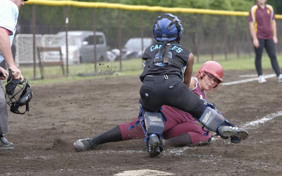 Osan's Jade Canales tags Matthew C. Perry's Tenacity Clayton at the plate during pool play of the Far East Tournament at Yokota Air Base, Japan on May 19, 2015. Osan defeated Perry 18-3 to take the second seed in their bracket.