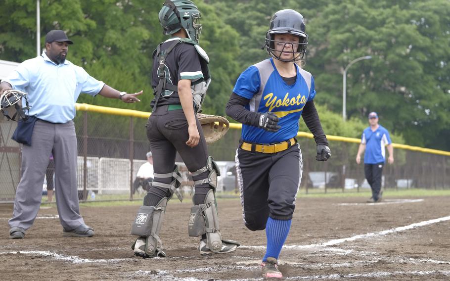 Yokota's Taylor Peche races through home plate to cap off an inside the ballpark home run during pool play of the Far East Tournament at Yokota Air Base, Japan on May 19, 2015. Osan defeated Daegu 8-5 to take the top seed in their bracket.