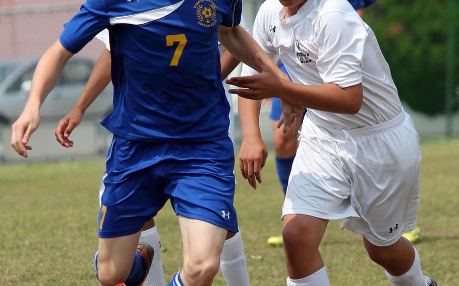 Yokota's Jack Liddle and Robert D. Edgren's Ben Christenson battle for the ball during Wednesday's boys D-II soccer match, won by the Panthers 2-1.