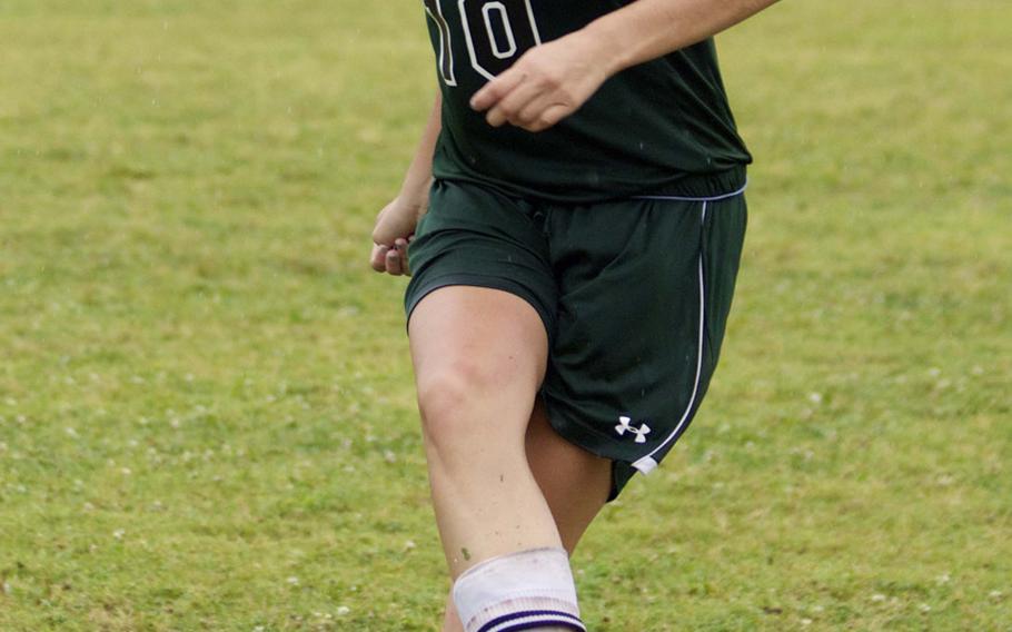 Kubasaki's Marissa Mesquita lines up a shot in her final appearance in Dragons green and white.